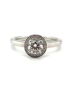 Platinum 0.54ct round brilliant cut Diamond solitaire ring with Diamond halo